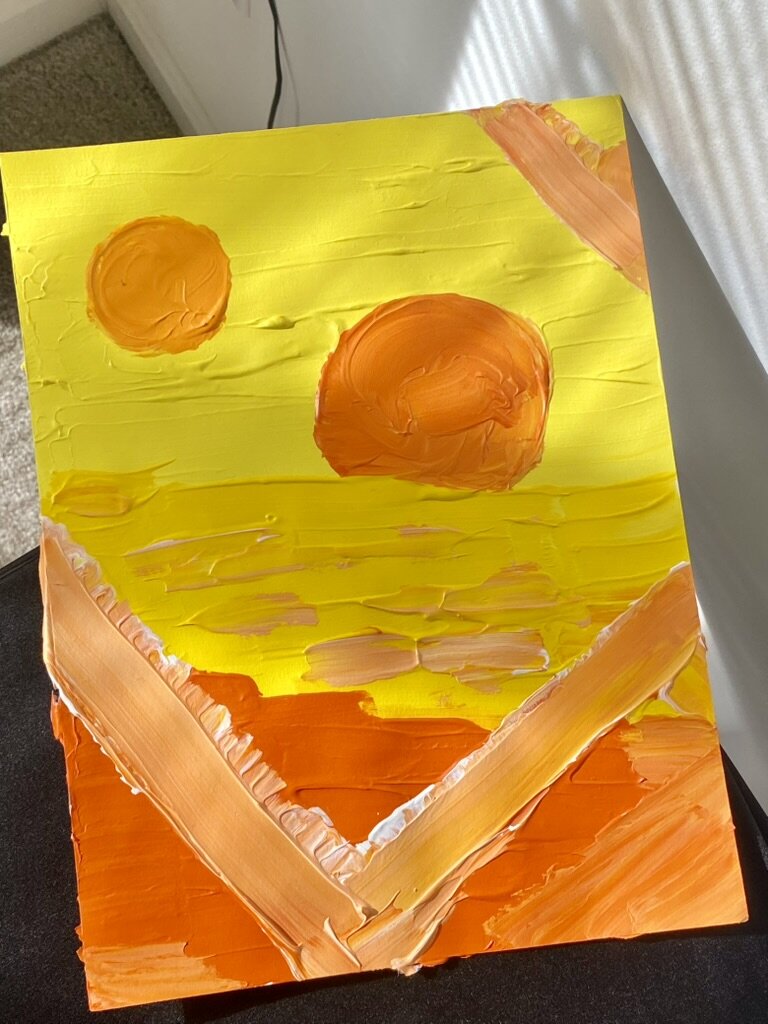 Painting of two orange suns over a yellow sky.